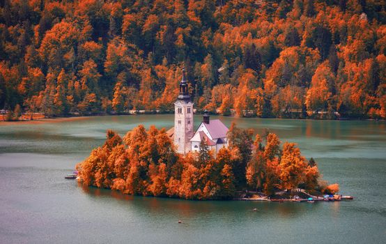 Autumn view on Bled Lake with Pilgrimage Church of the Assumption of Maria. Top view Bled, Slovenia, Europe. Autumn Lake Bled. Lake Bled with small Bled Island during autumn. Bled, Slovenia.