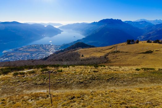 View of Locarno and Lake Maggiore from the Cardada-Cimetta mountain range, with a chairlift. Ticino canton, Switzerland