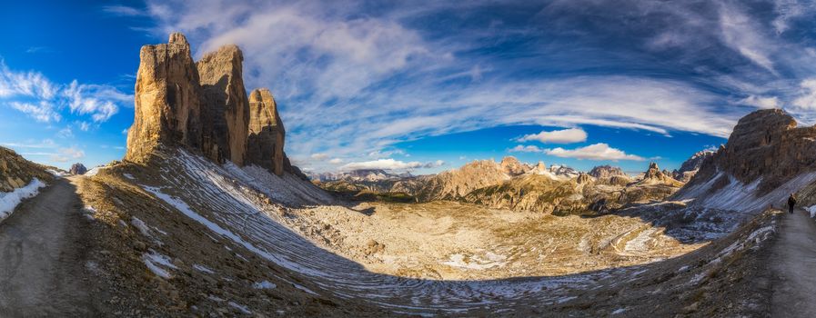 Hiking Trail in Tre Cime di Laveredo. Lake. Meadow. Green Grass. Summer. Blue Sky. Mountain Peak. Dolomites. Italy. Tre cime are one of the best-known mountain groups in the European Alps