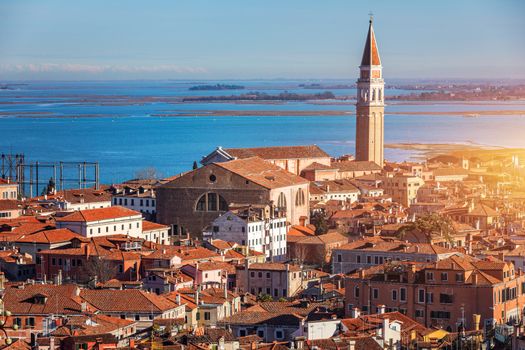 Venice panoramic aerial view with red roofs, Veneto, Italy. Aerial view with dense medieval red roofs of Venice, Italy 