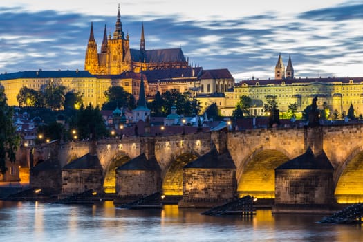 Famous iconic image of Prague castle and Charles Bridge, Prague, Czech Republic. Concept of world travel, sightseeing and tourism.