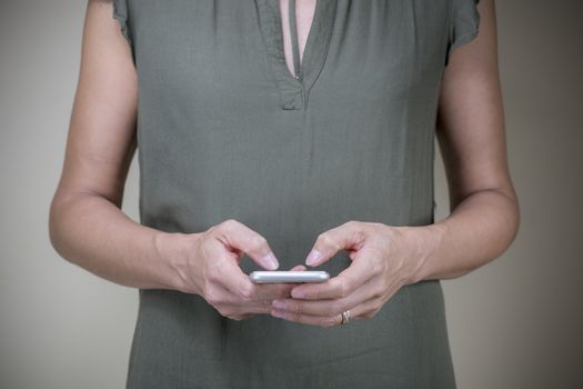 Woman (44 years old) using a smart phone