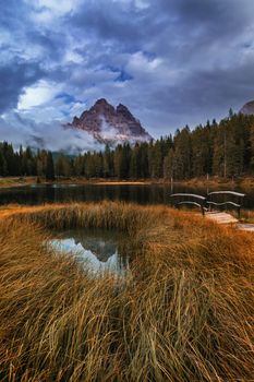 Autumn view with red foliage of Alps with lake in Tyrol