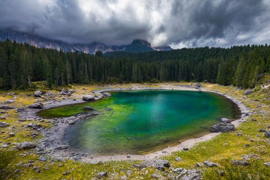 Carezza lake (Lago di Carezza, Karersee) with Mount Latemar, Bolzano province, South tyrol, Italy.