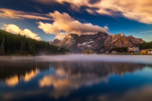 Misurina Lake in the Dolomites mountains in Italy near Auronzo di Cadore on a cloudy day, Sorapiss mountain in the background. South Tyrol, Dolomites, Italy.
