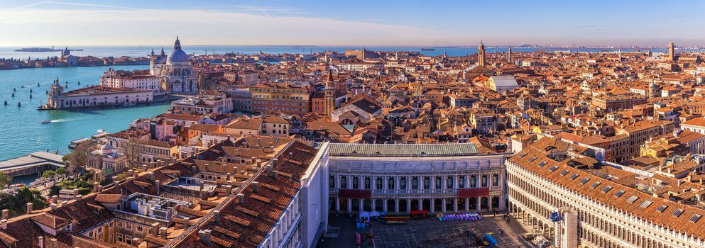 Venice panoramic aerial view with red roofs, Veneto, Italy. Aerial view of the Venice city, Italy. Venice is a popular tourist destination of Europe. Venice, Italy.