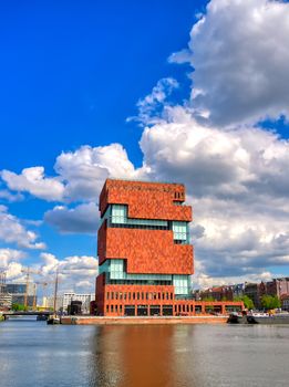 Antwerp, Belgium - April 26, 2019: Museum aan de Stroom (MAS) along the river Scheldt and the Port of Antwerp in Antwerp, Belgium.