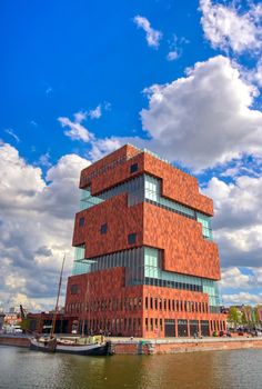 Antwerp, Belgium - April 26, 2019: Museum aan de Stroom (MAS) along the river Scheldt and the Port of Antwerp in Antwerp, Belgium.