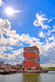 Antwerp, Belgium - April 26, 2019: Museum aan de Stroom (MAS) along the river Scheldt and the Port of Antwerp in Antwerp, Belgium.