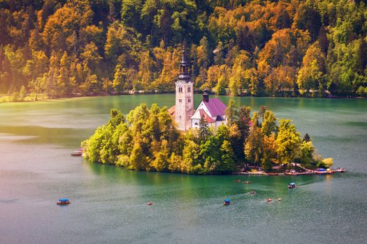 Autumn view on Bled Lake with Pilgrimage Church of the Assumption of Maria. Top view Bled, Slovenia, Europe. Autumn Lake Bled. Lake Bled with small Bled Island during autumn. Bled, Slovenia.