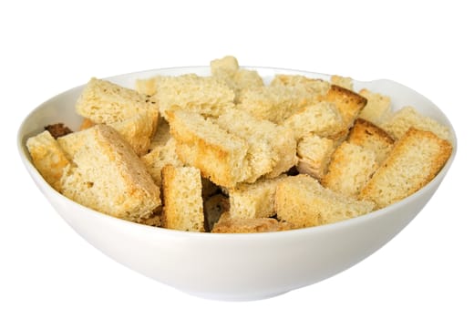 Crispy croutons in a white dish isolated on white. Clipping path included. 