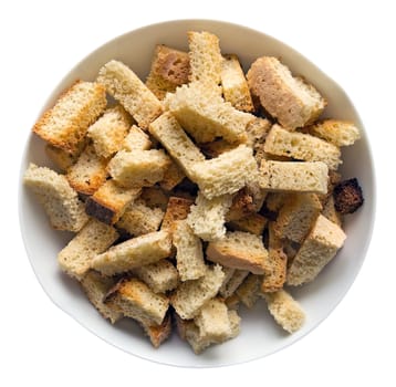 Crispy croutons in a white dish isolated on white. Clipping path included. 