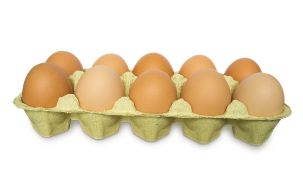 A carton of ten eggs isolated on white background. Clipping path included.