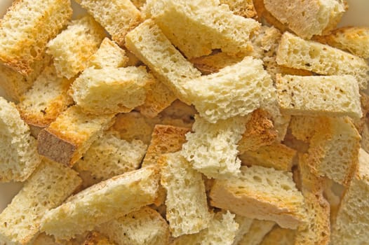 Crispy brown croutons close up shot for background