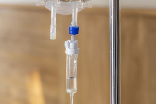 Close up fluid drop and medical intravenous drip for a patient