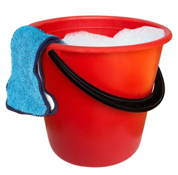 Red plastic bucket and floor cloth isolated on white background. Clipping path includes.