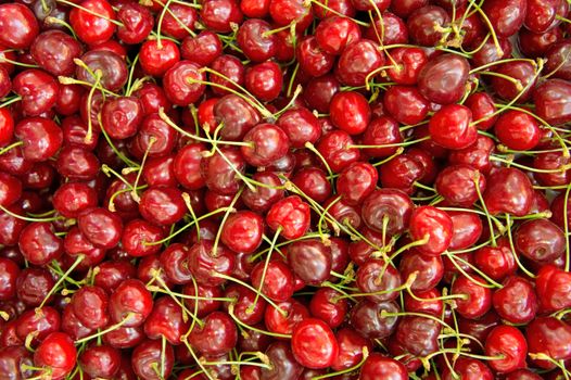 Cherries in the box in the fruits market.