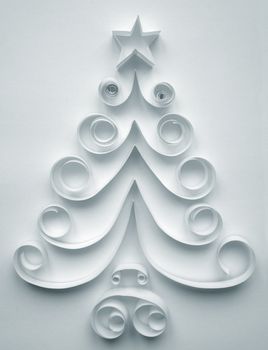 Christmas tree made of paper on white background