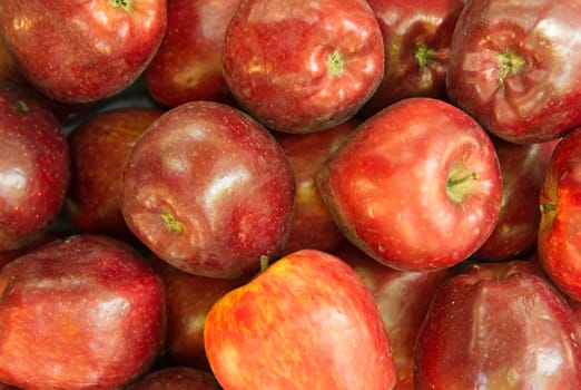 Lots of Red ripe apples background.