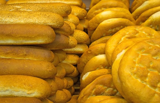 Lot of freshly baked french bread with crispy crust