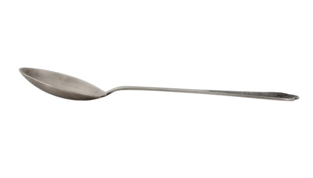 Old silver spoon with ornament isolated on white. Clipping path included