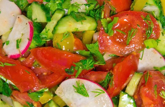 Close up view of appetizing vegetable salad background.