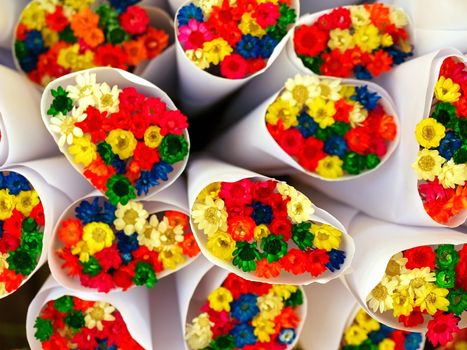 Background of bouquets of dry multi-coloured flowers on the street market in Paris, France.