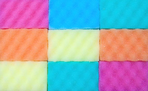 Close-up of colorful kitchen sponges background.