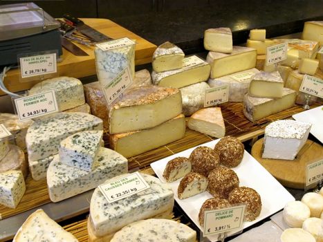 Assorted cheeses for sale on french market.