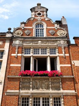 Facade of old Brussels building with classic red brick.