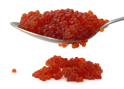Red caviar on a spoon isolated over white background