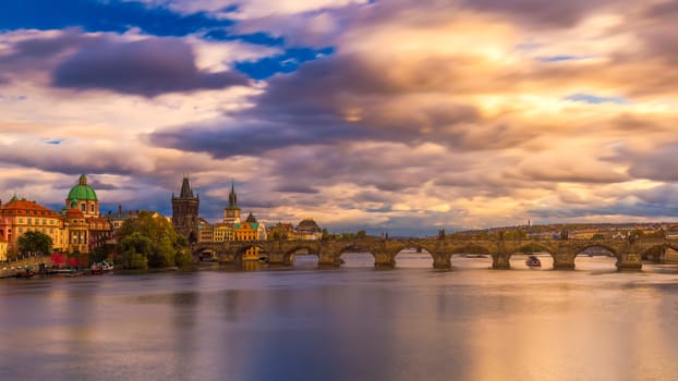 Famous iconic image of Charles bridge at sunset in spring, Prague, Czech Republic. Concept of world travel, sightseeing and tourism.