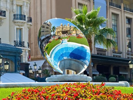 The Grand Casino in Monte Carlo reflected in a mirror located in the fountain outside, Monaco