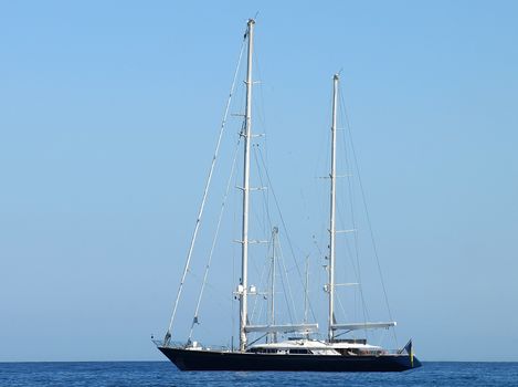 Black Sailboat in Gulf of Saint-Tropez, French Riviera, France