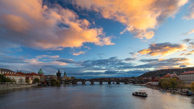 Scenic spring sunset aerial view of the Old Town pier architecture and Charles Bridge over Vltava river in Prague, Czech Republic