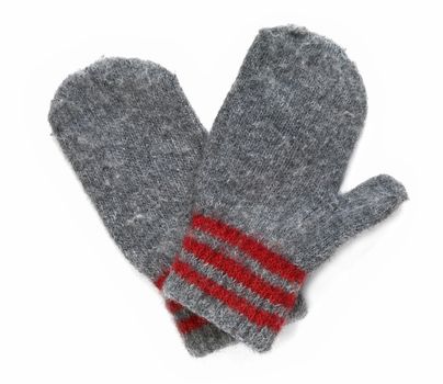 Grey mittens with red stripe on wrist over white background