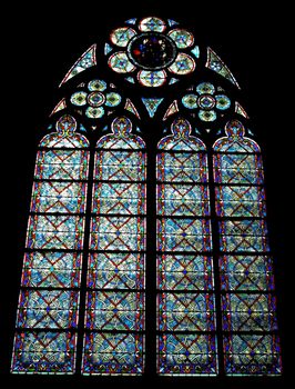 Stained glass window inside Notre Dame Cathedral in Paris, France.