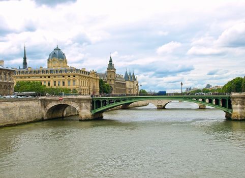 View of Palais de Justice and a bridge over the Seine river. Paris, France.
