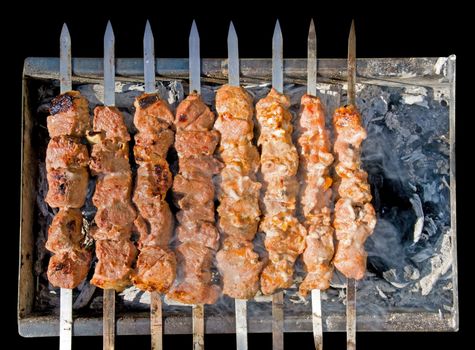 Shashlik (shish kebab) - traditional georgian barbecue prepared on a vine wood coal. Clipping path.