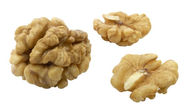 Kernels of walnuts on white background.