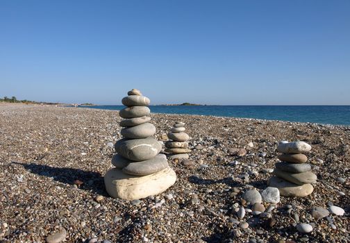balanced stones on a beach