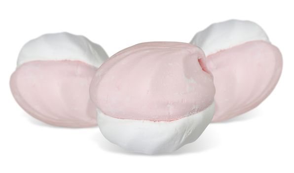 Three pink-white zephyr cakes with shadow isolated over white.