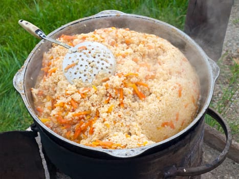 Uzbek pilaw - rice with meat, spices and carrots.