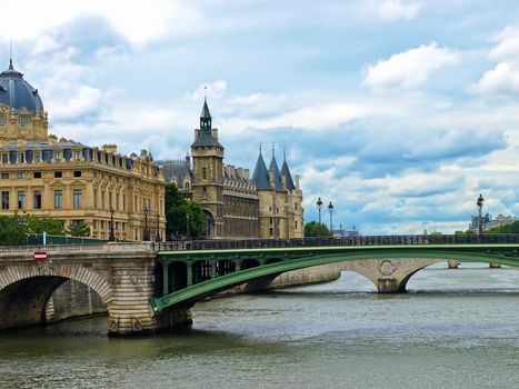 View of Palais de Justice and a bridge over the Seine river. Paris, France.