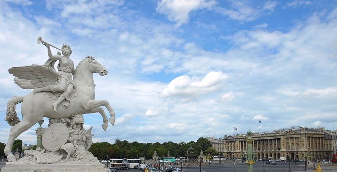 Winged statue at the entrance to the Jardins des Tuileries on the Place de la Concorde.