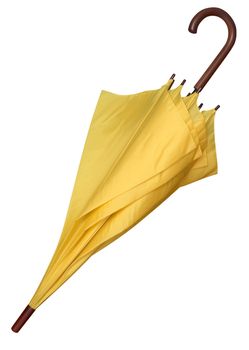 Closed yellow umbrella isolated on white background. Clipping path.