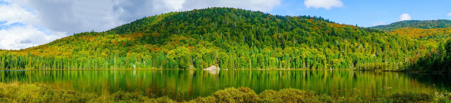 Panoramic view of Lauzon lake and fall foliage colors, in Mont Tremblant National Park, Quebec, Canada