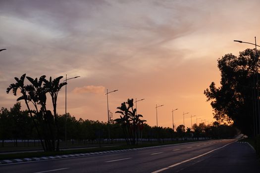 a lonly empty road by the time of sunset. High quality photo
