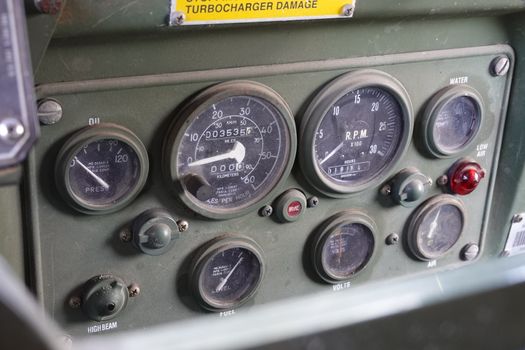 an old dirty rustick military truck dashboard.