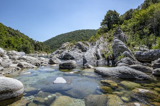 Pure and fresh water natural pool of Travu River, Corsica, France, Europe (copy space in the sky)